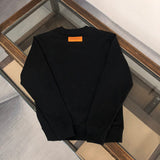 Close-up detail shot of Louis Vuitton luxury clothing with relaxed-fit cut