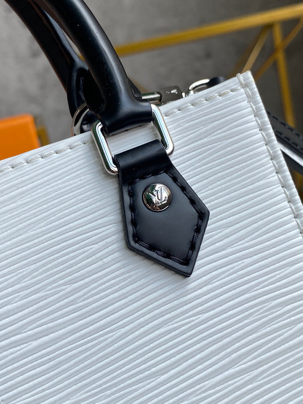 Side profile of classic refined women's handbag – women's luxury accessory
