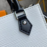 Side profile of classic refined women's handbag – women's luxury accessory