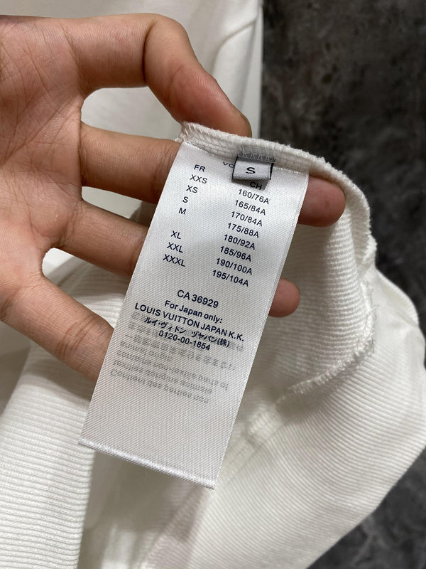 Back view of Louis Vuitton luxury clothing with label-forward styling