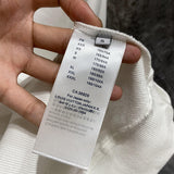 Back view of Louis Vuitton luxury clothing with label-forward styling
