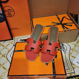 Hermès Red Slide Sandals - Lifestyle Styling Shot