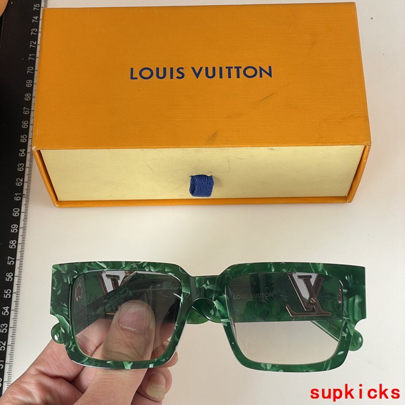 Close-up detail view of Louis Vuitton unisex sunglasses