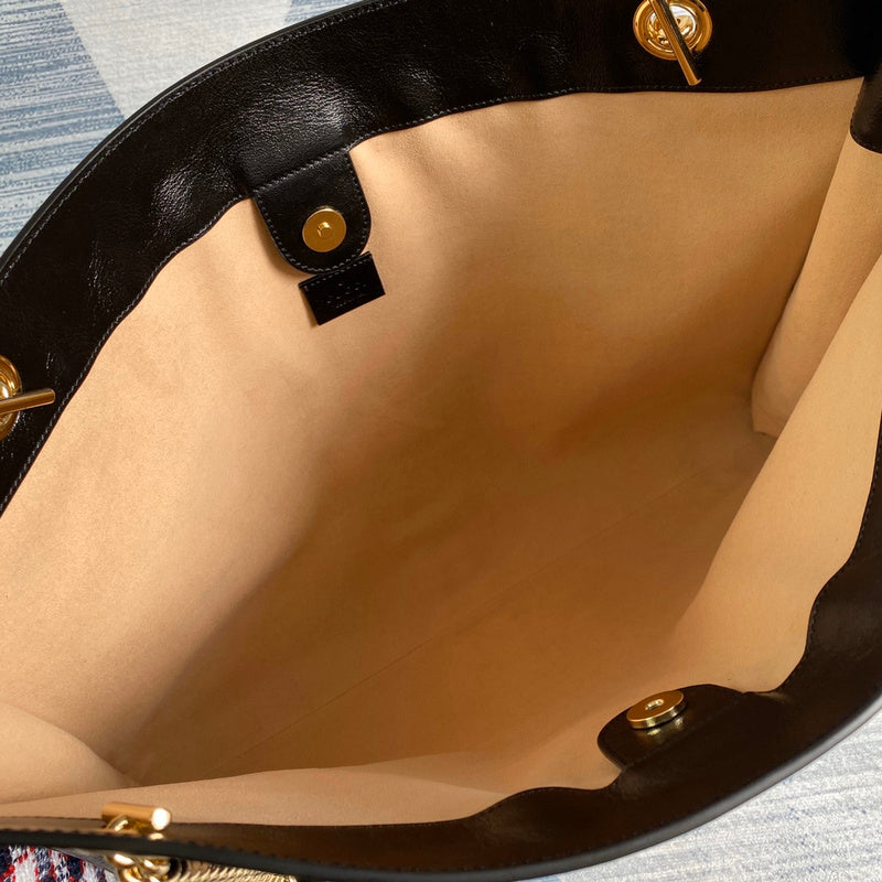 Side profile of modern everyday-luxe women's handbag – women's statement bag
