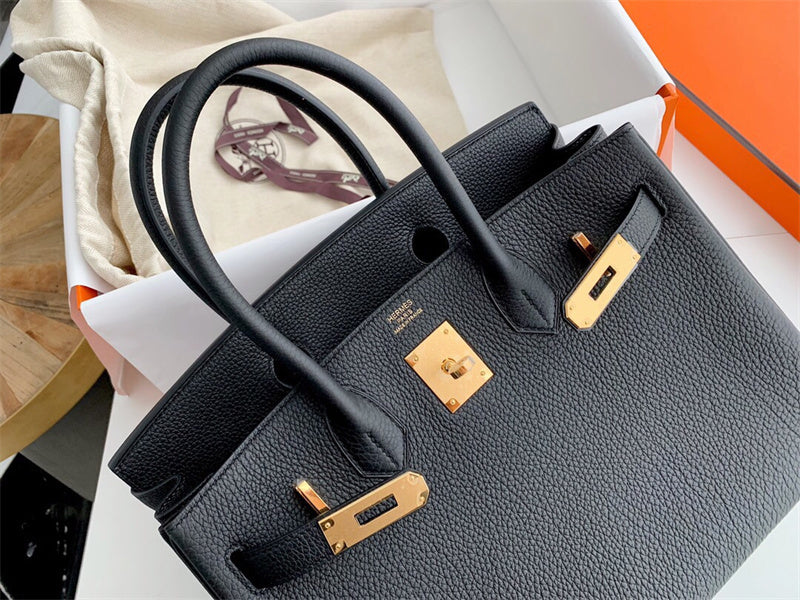 Side view of graceful structured handbag