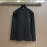 Side profile of Louis Vuitton luxury clothing with tailored silhouette