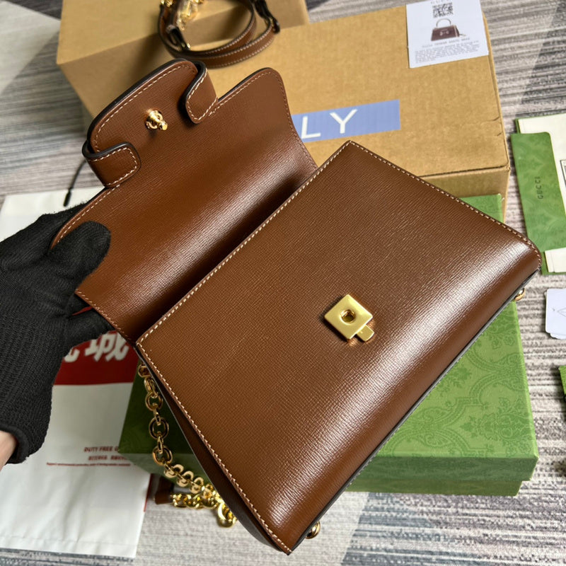 Side profile of signature sleek women's handbag – women's statement bag