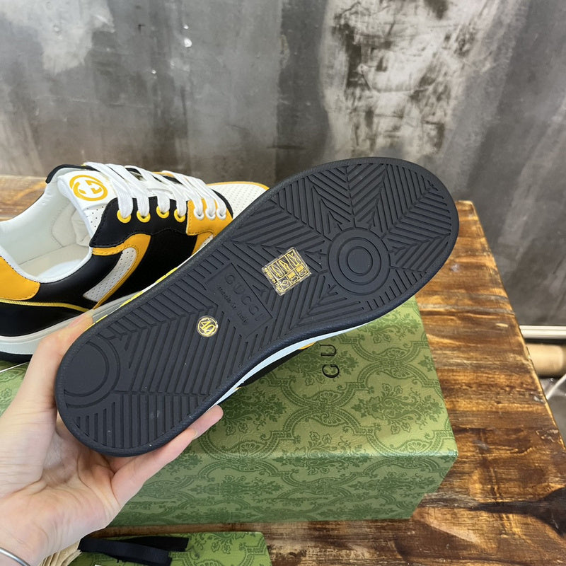 Side profile of Gucci classic monochrome sneakers retro runner design