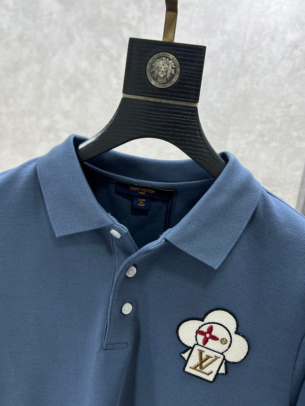 Close-up detail shot of Louis Vuitton luxury clothing with logo-detail design