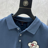 Close-up detail shot of Louis Vuitton luxury clothing with logo-detail design