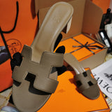 Hermès Tan Flat Thong Sandals - Lifestyle Styling Shot