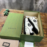 Side profile of Gucci two-tone sneakers streetwear statement look