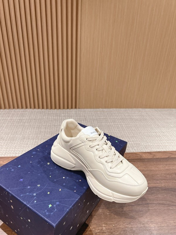 Side profile of Gucci tonal black sneakers bold athletic profile