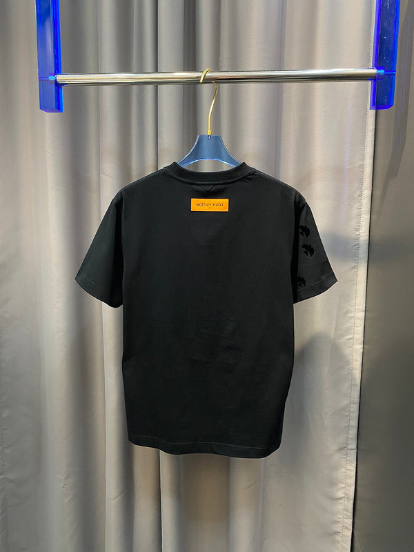 Flat lay presentation of Louis Vuitton cotton t-shirt with signature branding