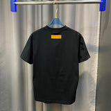 Flat lay presentation of Louis Vuitton cotton t-shirt with signature branding