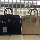 Side view of clean-lined structured handbag