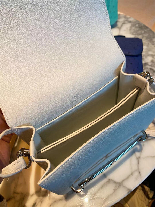 Side view of fluid structured handbag