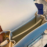 Side view of fluid structured handbag