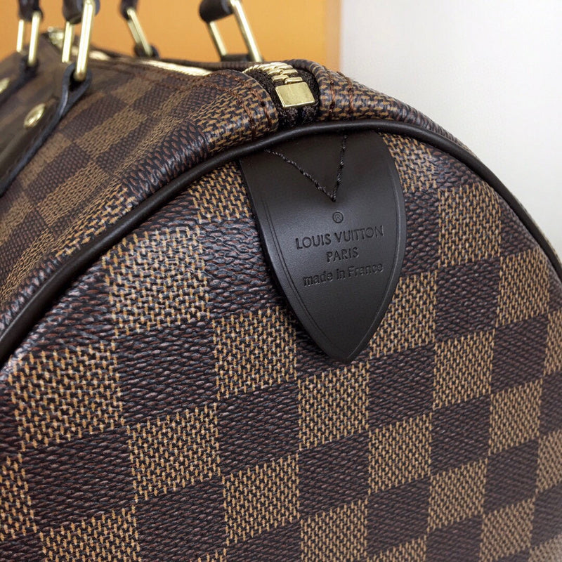 Side profile of classic polished women's handbag – women's luxury handbag