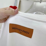 Side profile of Louis Vuitton luxury clothing with runway-inspired design