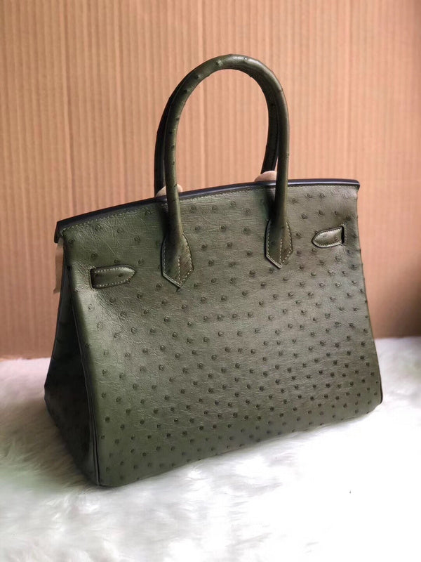 Side view of clean-lined structured handbag