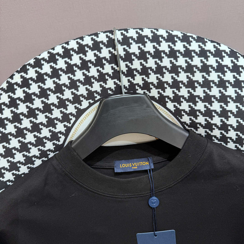 Close-up detail shot of Louis Vuitton cotton t-shirt with logo-detail design
