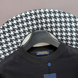 Close-up detail shot of Louis Vuitton cotton t-shirt with logo-detail design