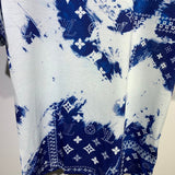 Flat lay presentation of Louis Vuitton cotton t-shirt with signature branding