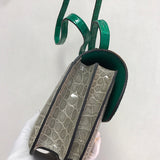 Close-up detail of poised bag design