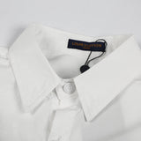 Flat lay presentation of Louis Vuitton luxury clothing with monogram-inspired silhouette