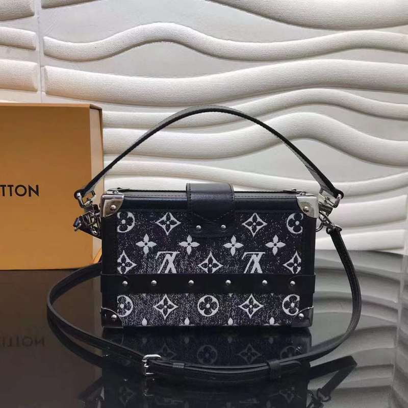 Styled lifestyle shot of signature classic women's handbag – women's statement bag
