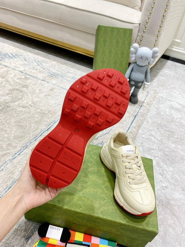 Side profile of Gucci neutral cream sneakers breathable knit upper