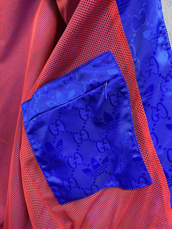 Flat lay presentation of Gucci luxury clothing with label-forward styling