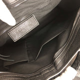 Side profile of chic structured women's handbag – women's statement bag
