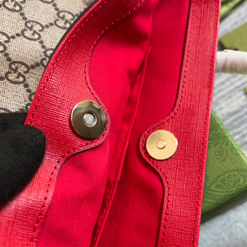 Side profile of classic signature women's handbag – women's luxury accessory