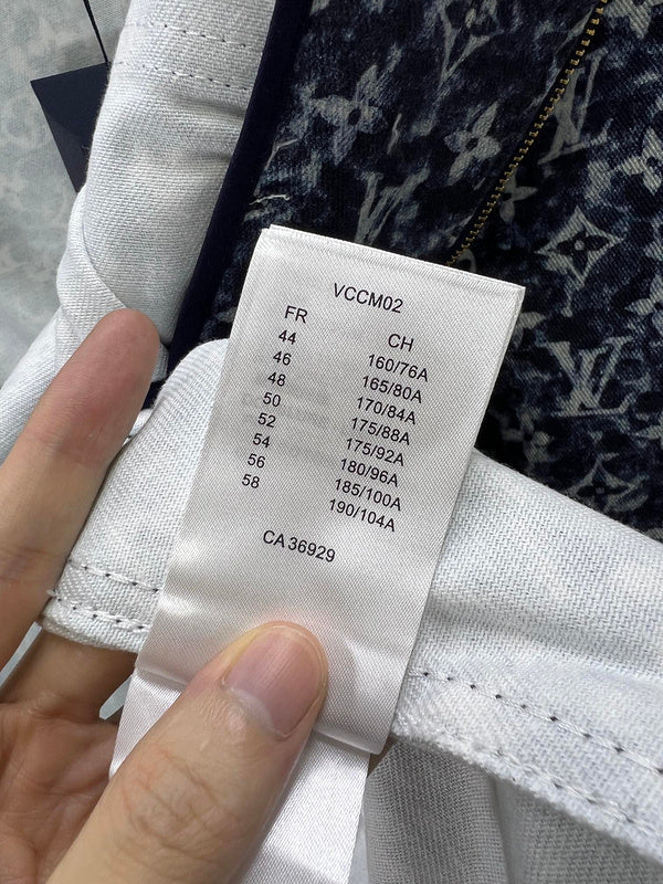 Close-up detail shot of Louis Vuitton luxury clothing with runway-inspired design