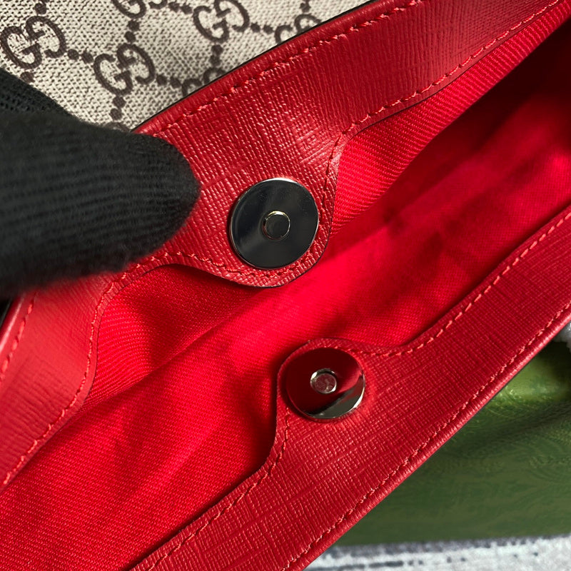 Front view of structured classic women's handbag – women's luxury accessory