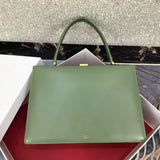 Side profile of everyday-luxe structured women's handbag – women's luxury accessory