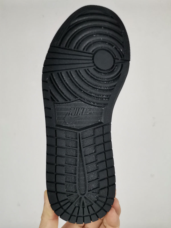 Side profile of Nike soft grey sneakers premium leather build
