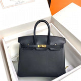 Side view of tailored structured handbag