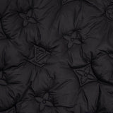 Flat lay presentation of Louis Vuitton luxury clothing with monogram-inspired silhouette