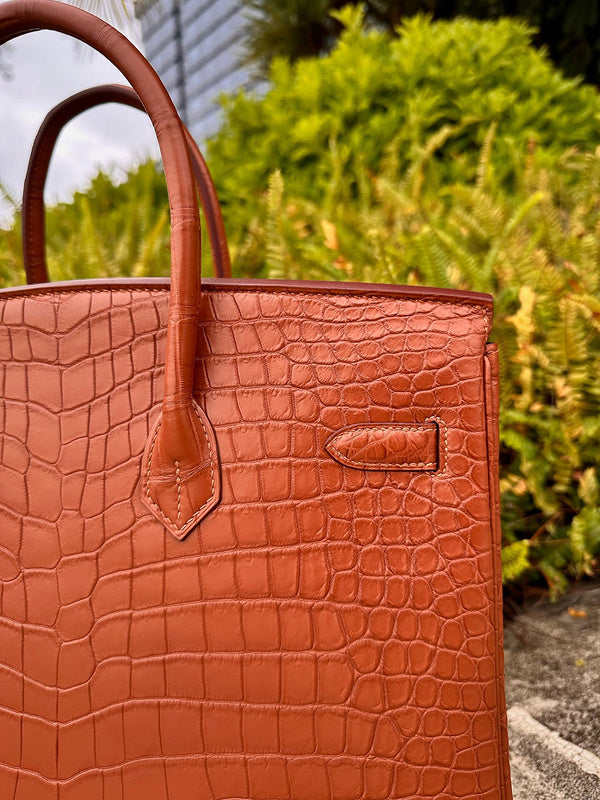 Side view of understated structured handbag
