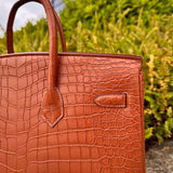 Side view of understated structured handbag