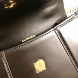 Side profile of chic sleek women's handbag – women's luxury accessory