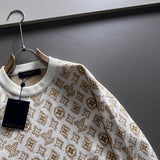 Close-up detail shot of Louis Vuitton luxury clothing with logo-detail design