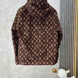 Flat lay presentation of Louis Vuitton luxury clothing with label-forward styling