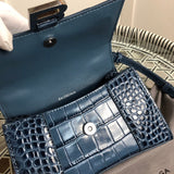 Side profile of sleek chic women's handbag – women's statement bag