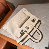 Side view of sculpted structured handbag