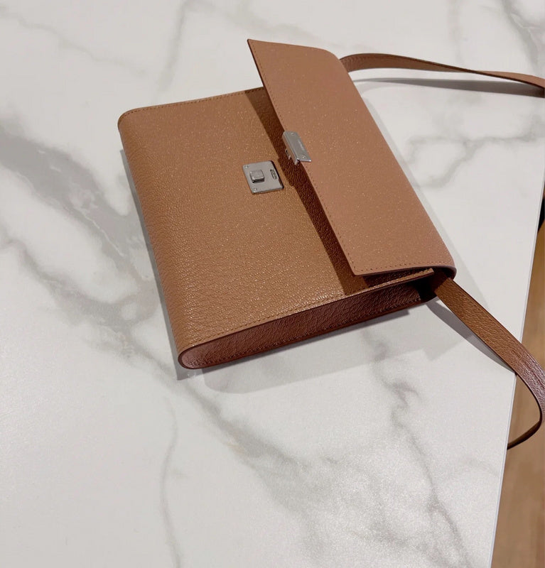 Side view of timeless structured handbag