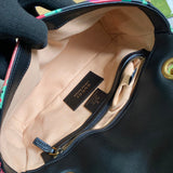 Side profile of signature polished women's handbag – women's luxury handbag